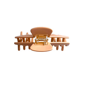 Back view of the Biscotti warm beige hat claw clip showing the spring hinge and wide opening for a secure hold.