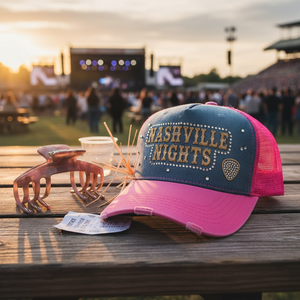 Blush pink hat claw clip displayed beside a pink trucker hat, showing its hat-friendly everyday styling use.