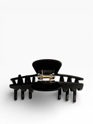 Back view of the Eclipse glossy black hat claw clip showing the spring hinge and wide opening for a secure hold.