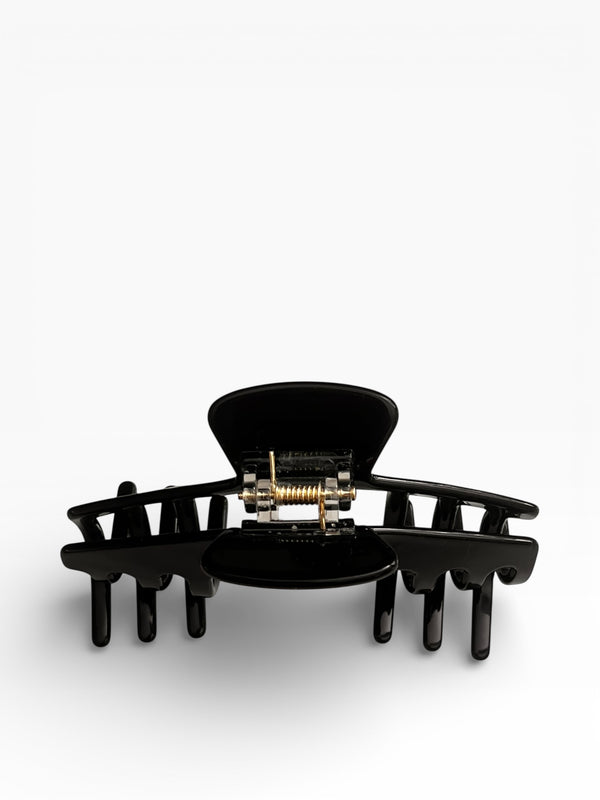 Back view of the Eclipse glossy black hat claw clip showing the spring hinge and wide opening for a secure hold.