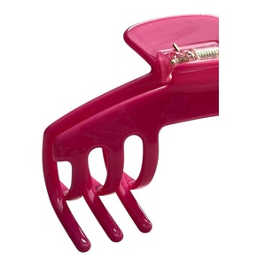 Close-up of the Flamingo hot pink hat claw clip highlighting the glossy finish, spring hinge, and curved grip teeth.