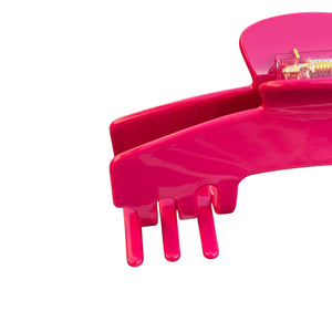 Close-up of the Fuchsia hot pink hat claw clip highlighting the smooth finish, spring hinge, and curved grip teeth.