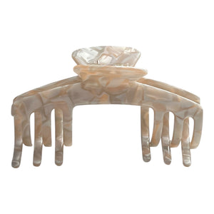 Front view of the Halo pearl beige hat claw clip designed for lightweight, comfortable everyday hairstyles with hats.