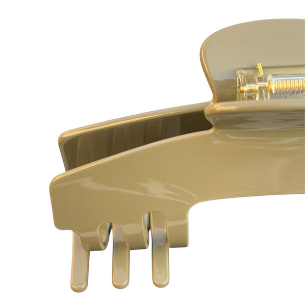 Close-up of the Haven taupe hat claw clip highlighting the smooth finish, durable spring hinge, and curved grip teeth.