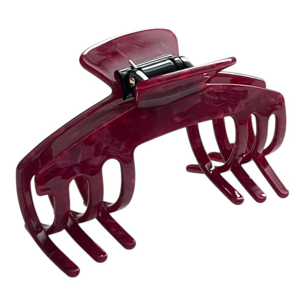 Angled view of the Merlot burgundy hat claw clip showing its curved shape, rich finish, and secure grip.