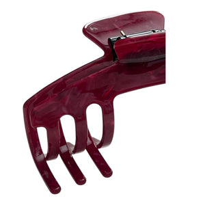 Close-up of the Merlot burgundy hat claw clip highlighting the glossy finish, spring hinge, and curved grip teeth.