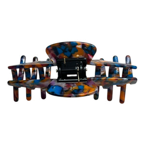 Back view of the Mosaic multicolor claw clip showing the hinge, spring, and wide claw opening.