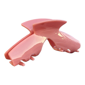 Side view of the Muse pink hat claw clip showing the low-profile design for comfortable wear with hats.