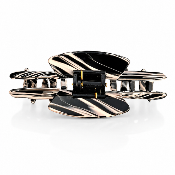 Top view of the Noir black and  view of the Noir black and white hat claw clip showing the spring hinge and wide opening for a secure hold.