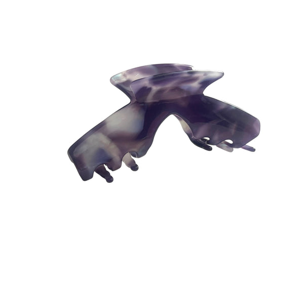 Angled view of the Nova purple marble hat claw clip showing its curved shape and secure grip for everyday hairstyles.