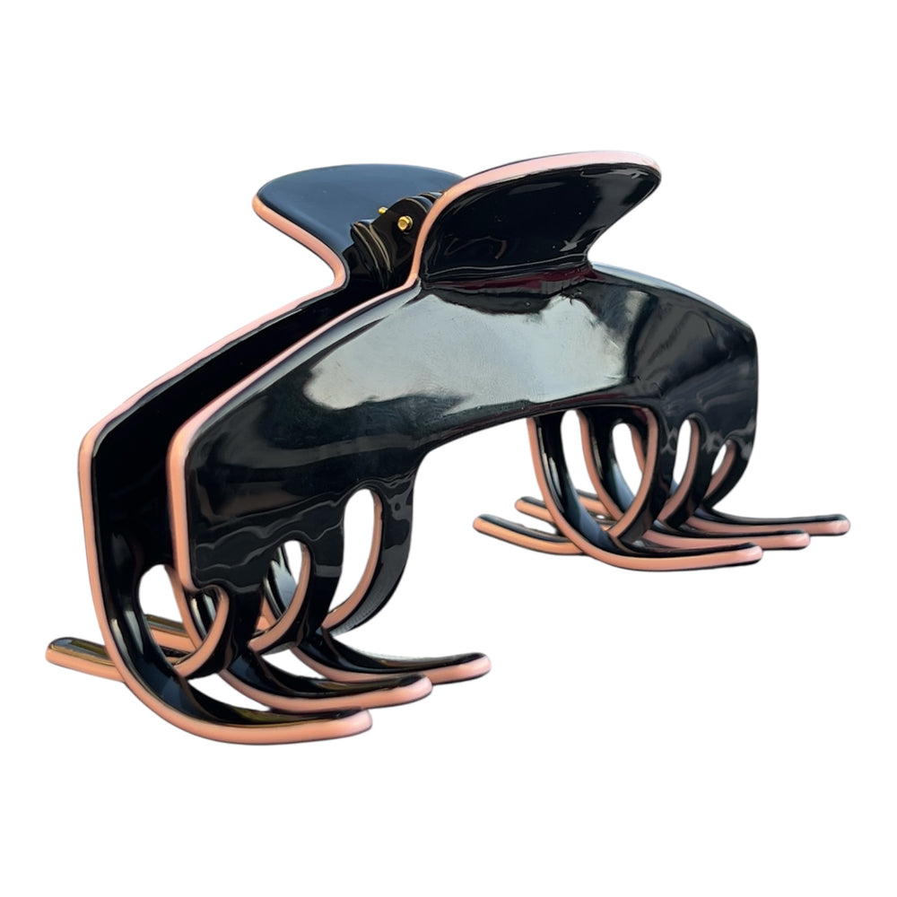 Angled view of the Onyx black hat claw clip showing its curved shape and strong Power Hold grip for long, thick hair.