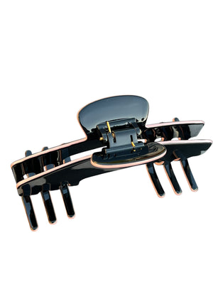 Top view of the Onyx black hat claw clip showing the hinge, teeth, and wide Power Hold design.