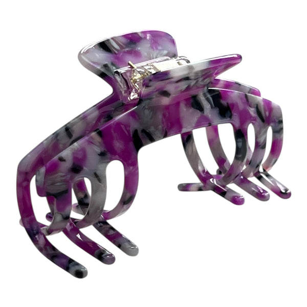Angled view of the Orchid purple marble hat claw clip showing its curved shape, bold pattern, and secure grip.