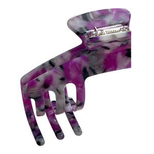 Close-up of the Orchid purple marble hat claw clip highlighting the glossy finish, curved teeth, and spring hinge.