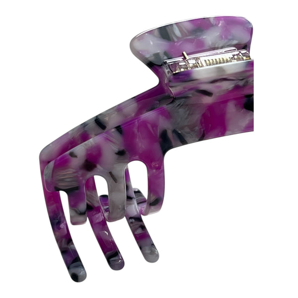 Close-up of the Orchid purple marble hat claw clip highlighting the glossy finish, curved teeth, and spring hinge.
