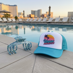 Sea Glass blue marble claw clip displayed beside a trucker hat near a swimming pool.