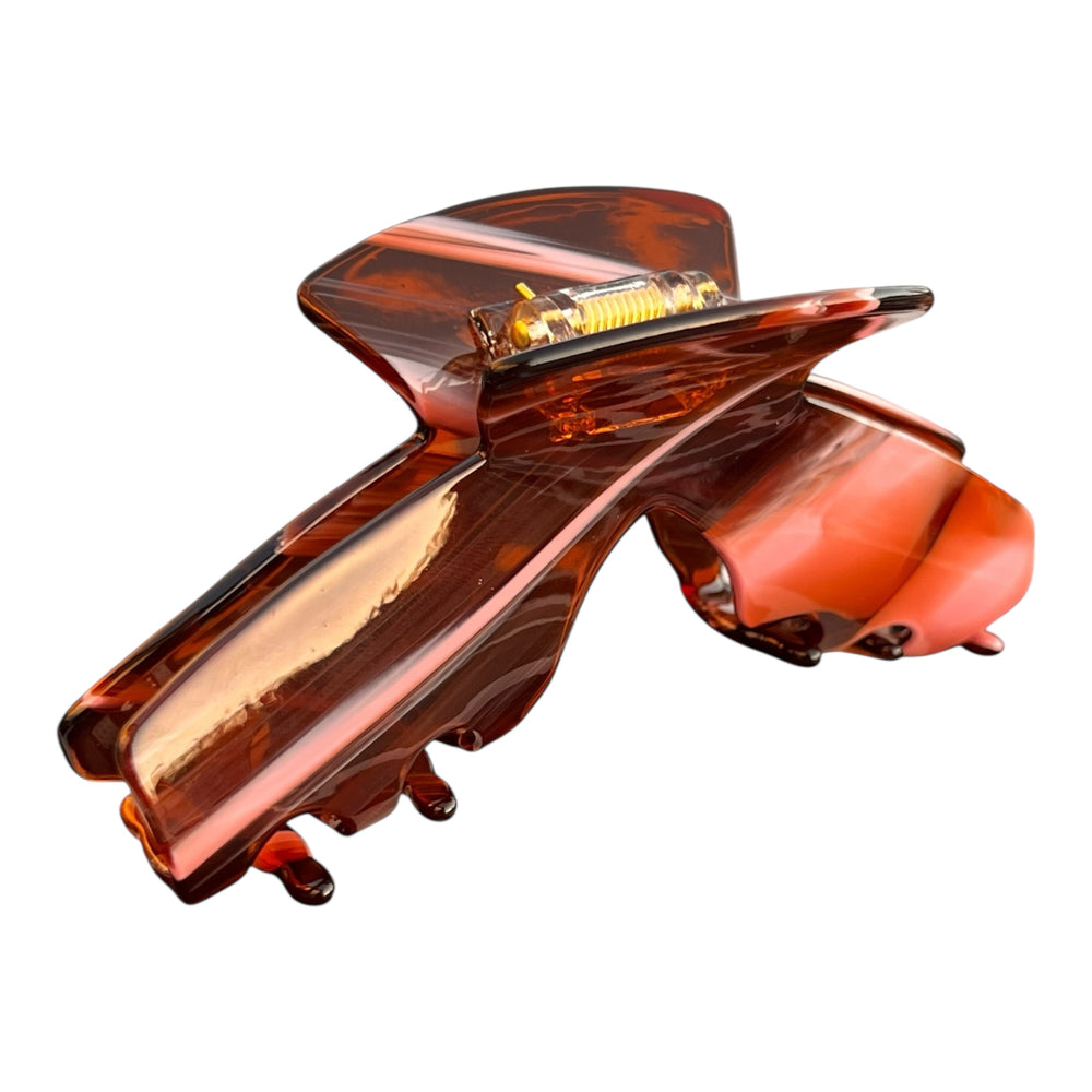 Siren amber tortoise hat claw clip front view designed to securely hold medium, thick, and long hair while wearing hats.