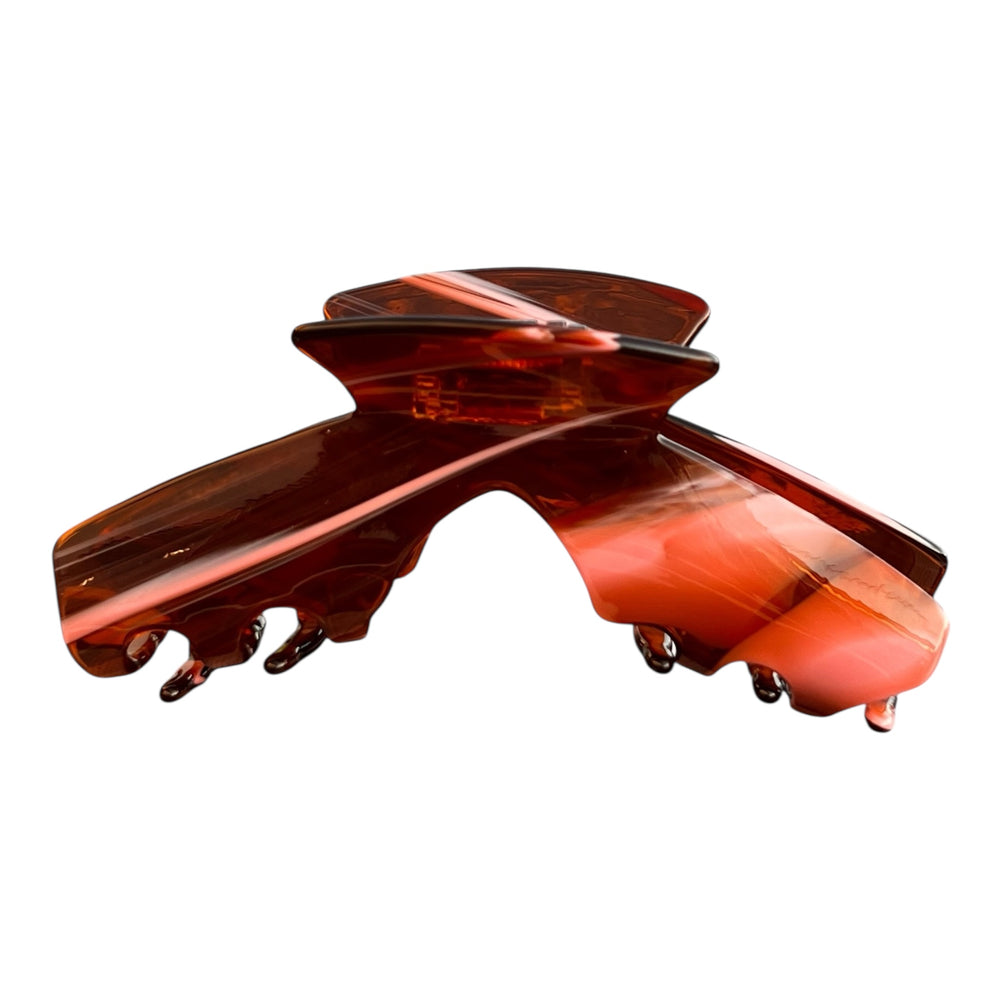 Siren amber tortoise hat claw clip front view designed to securely hold medium, thick, and long hair while wearing hats.