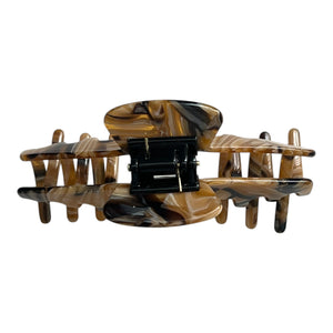 Back view of the Tortoise brown marble hat claw clip showing the spring hinge and wide opening for a secure hold.
